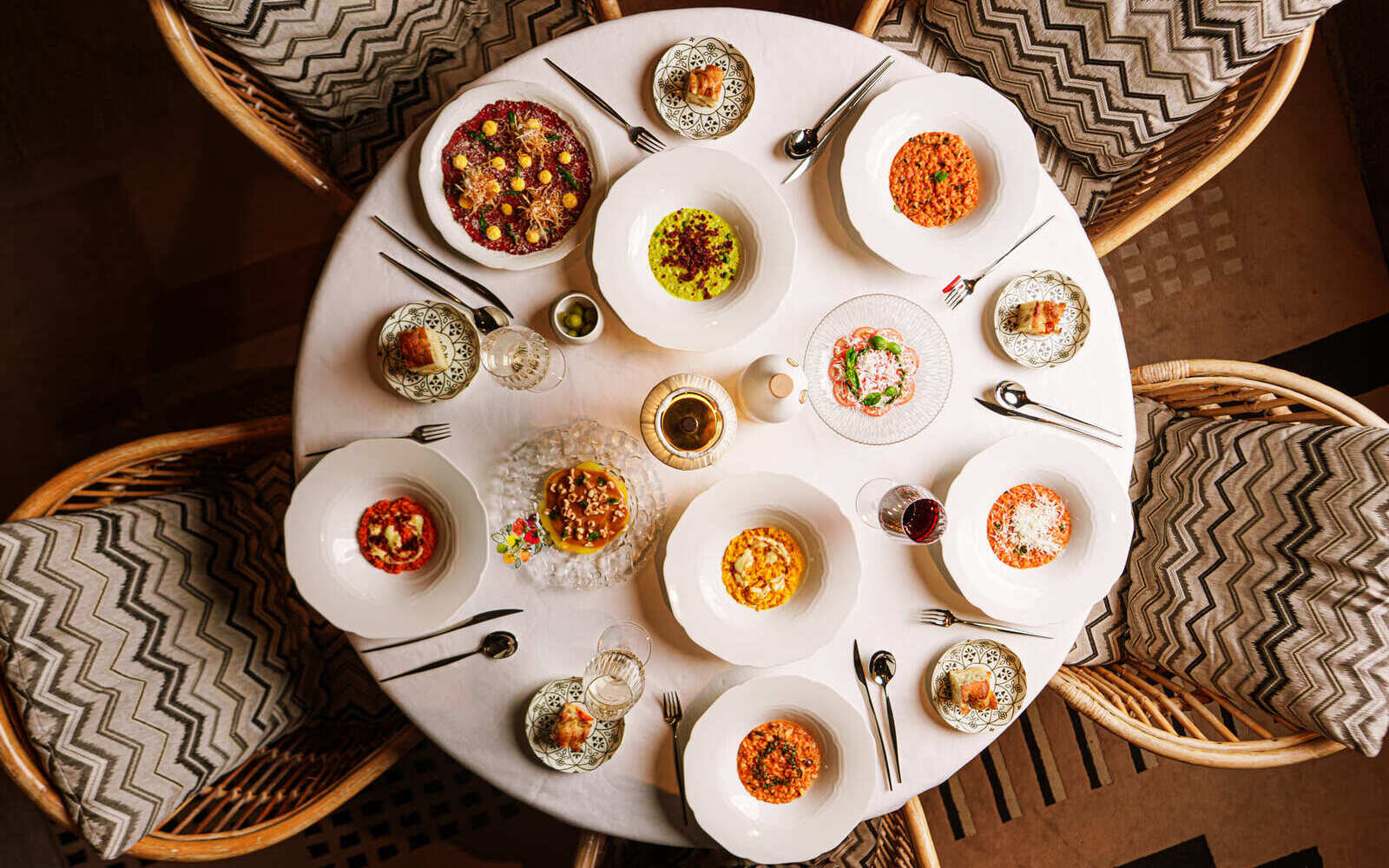 Arrogante Restaurant invites guests to choose two carpacci and two risotti from a curated selection.